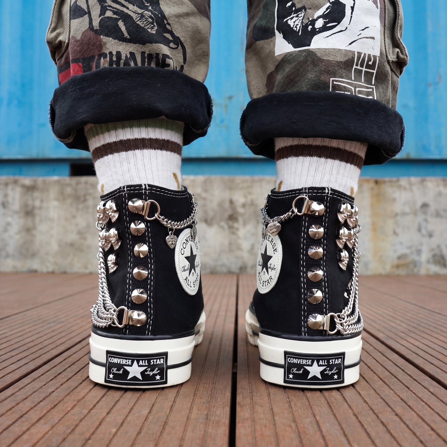 Punk rock Converse sneakers with silver chains, skull charms and spikes