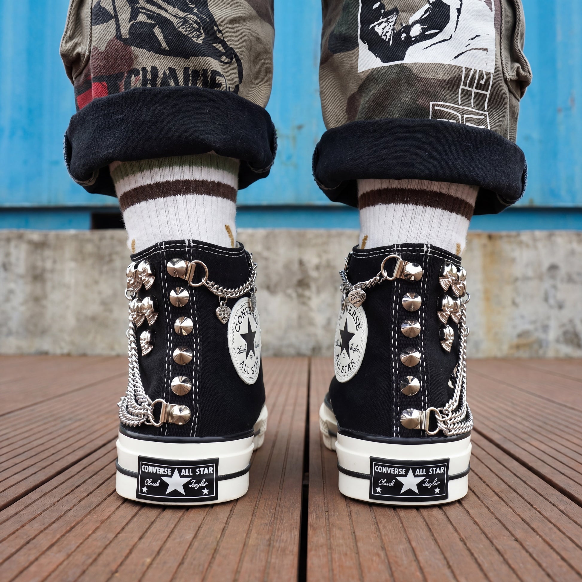 Punk rock Converse sneakers with silver chains, skull charms and spikes