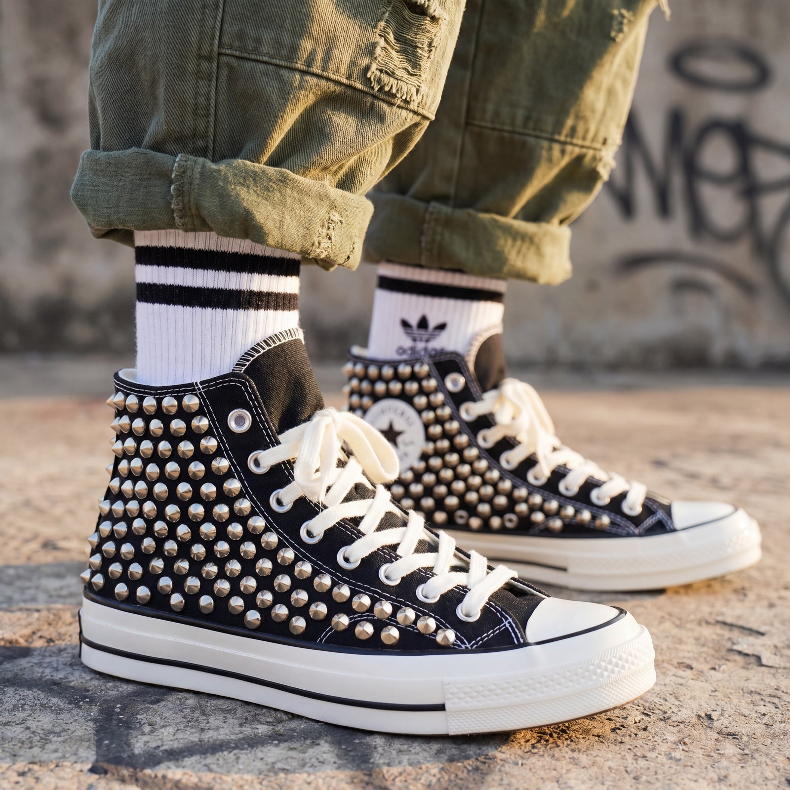 Black Converse high top sneakers with silver spike embellishments