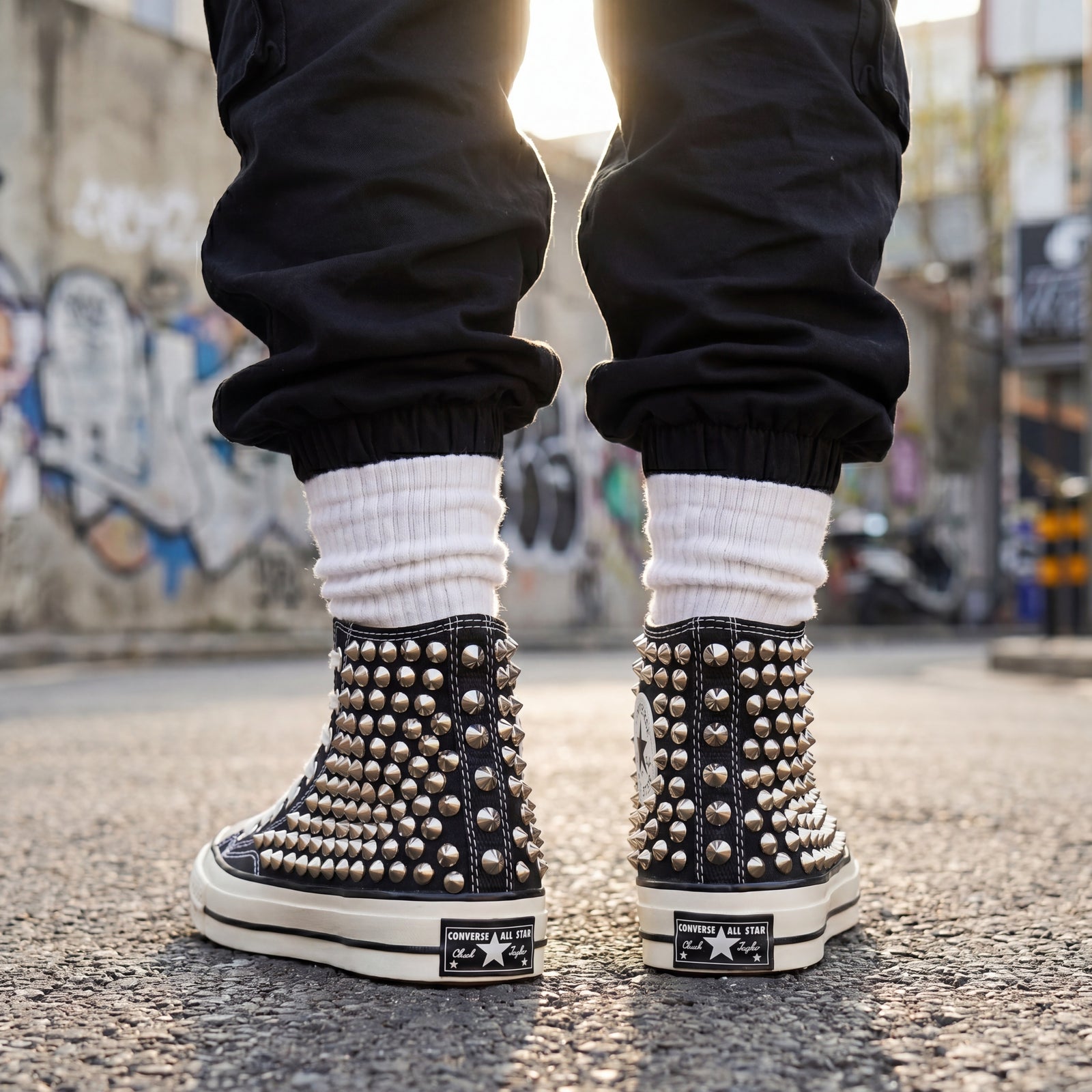 Punk streetwear canvas shoes with black upper, white laces and metal studs