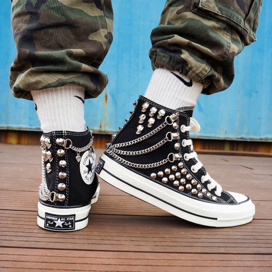 Black studded high top Converse sneakers with silver chains and skull charms