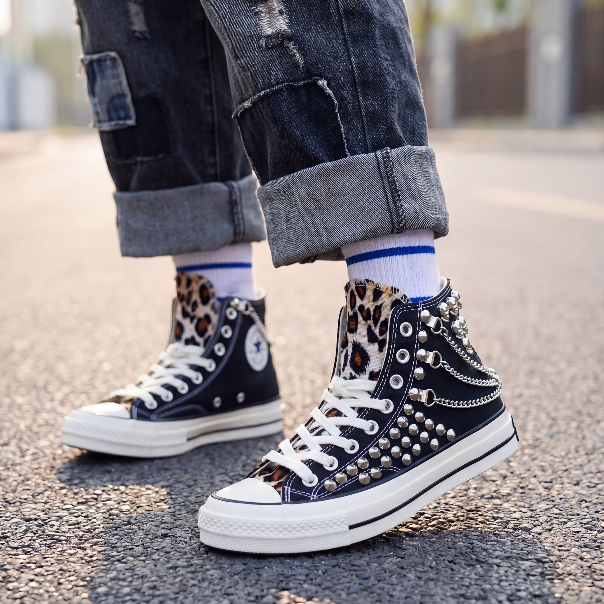 Black high top canvas sneakers with metal studs for streetwear fashion