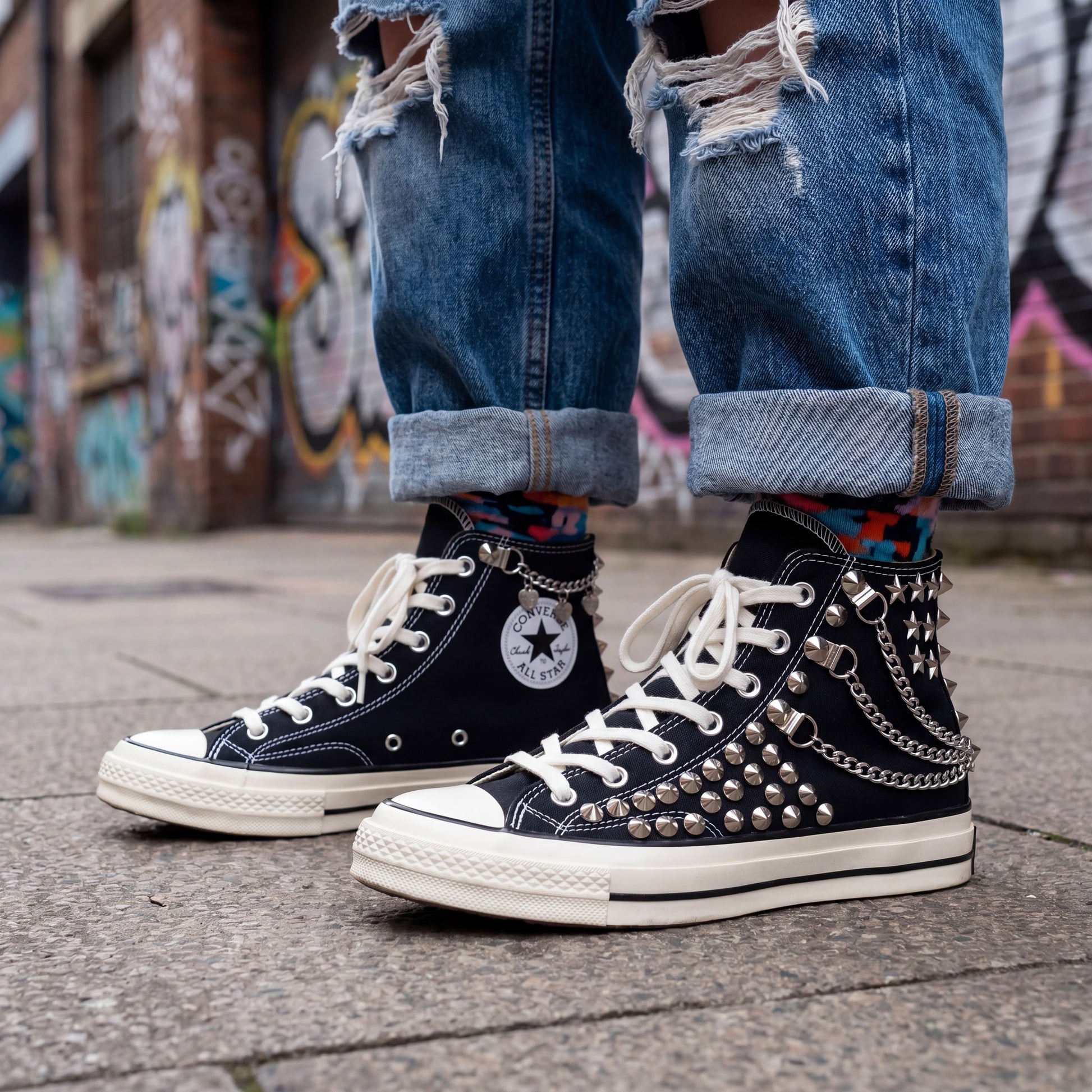 Black high top Converse shoes with studded details for streetwear fashion