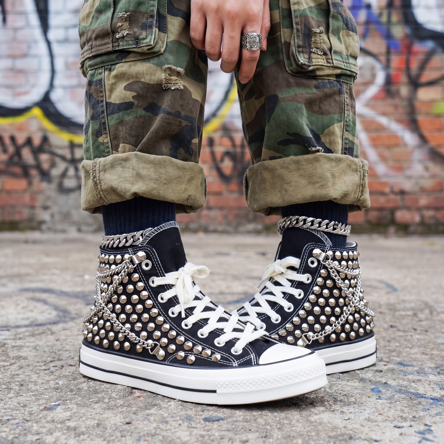 Punk rock Converse sneakers with chain details and metal spikes