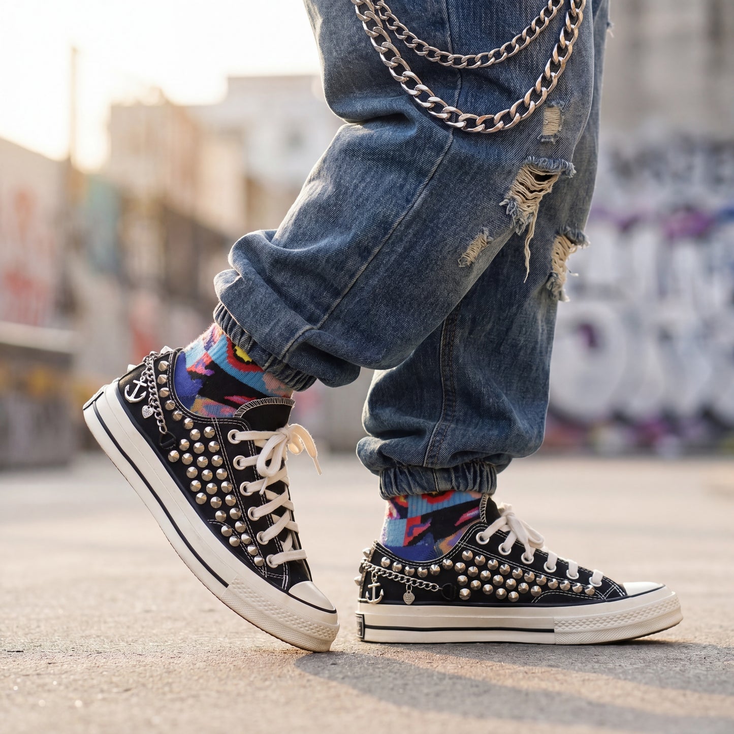 Black low top canvas sneakers with studded design for streetwear fashion