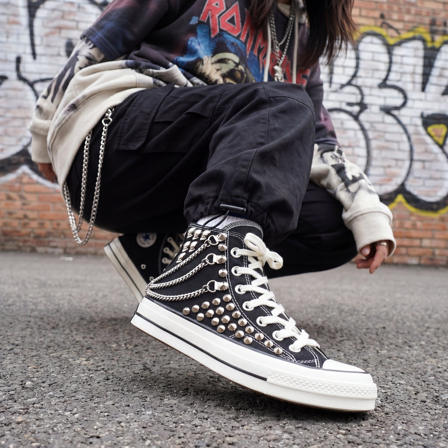 Black high top canvas sneakers with studded details for streetwear fashion