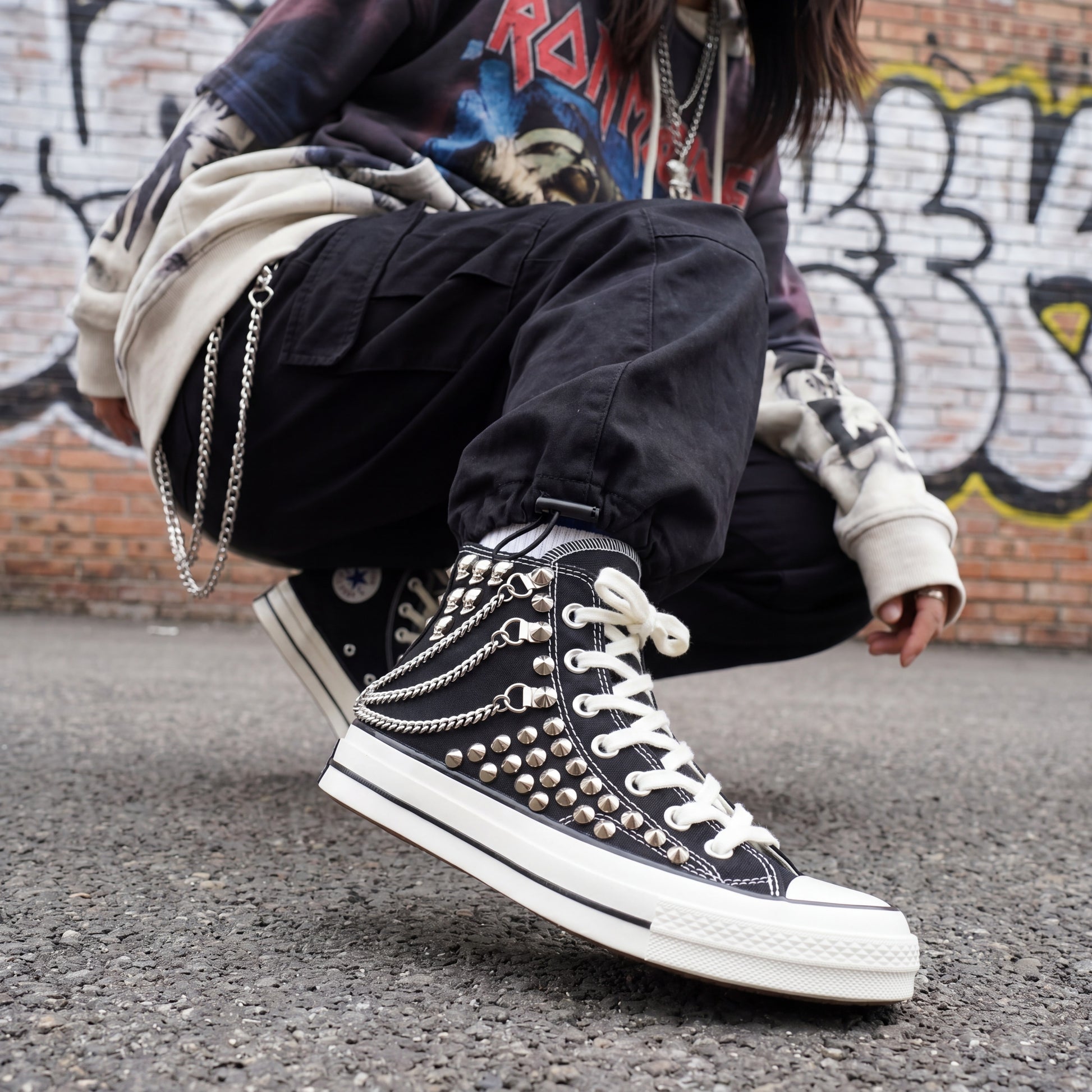 Black high top canvas sneakers with studded details for streetwear fashion