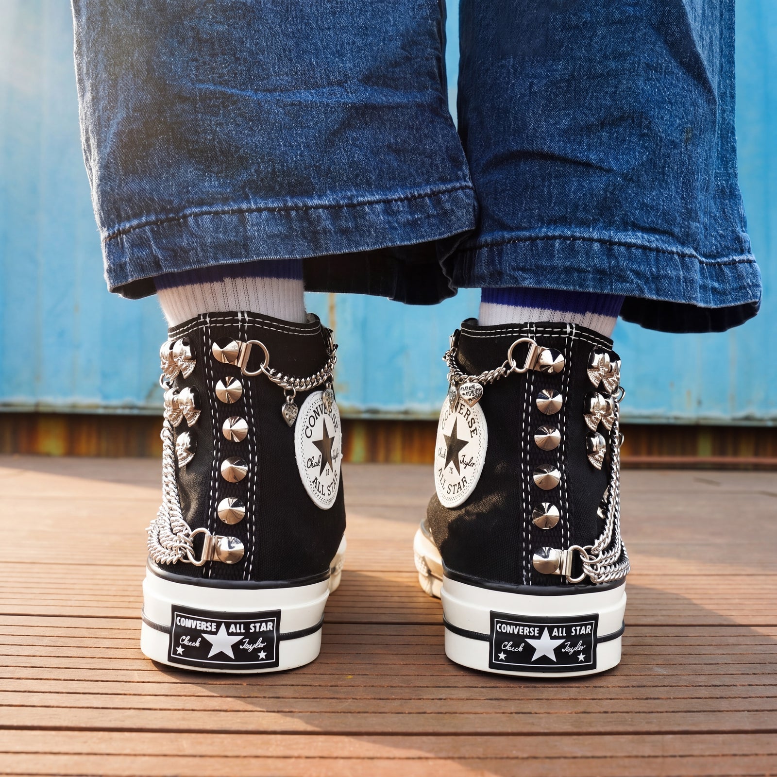 Punk streetwear canvas shoes with black upper, white laces and silver studs