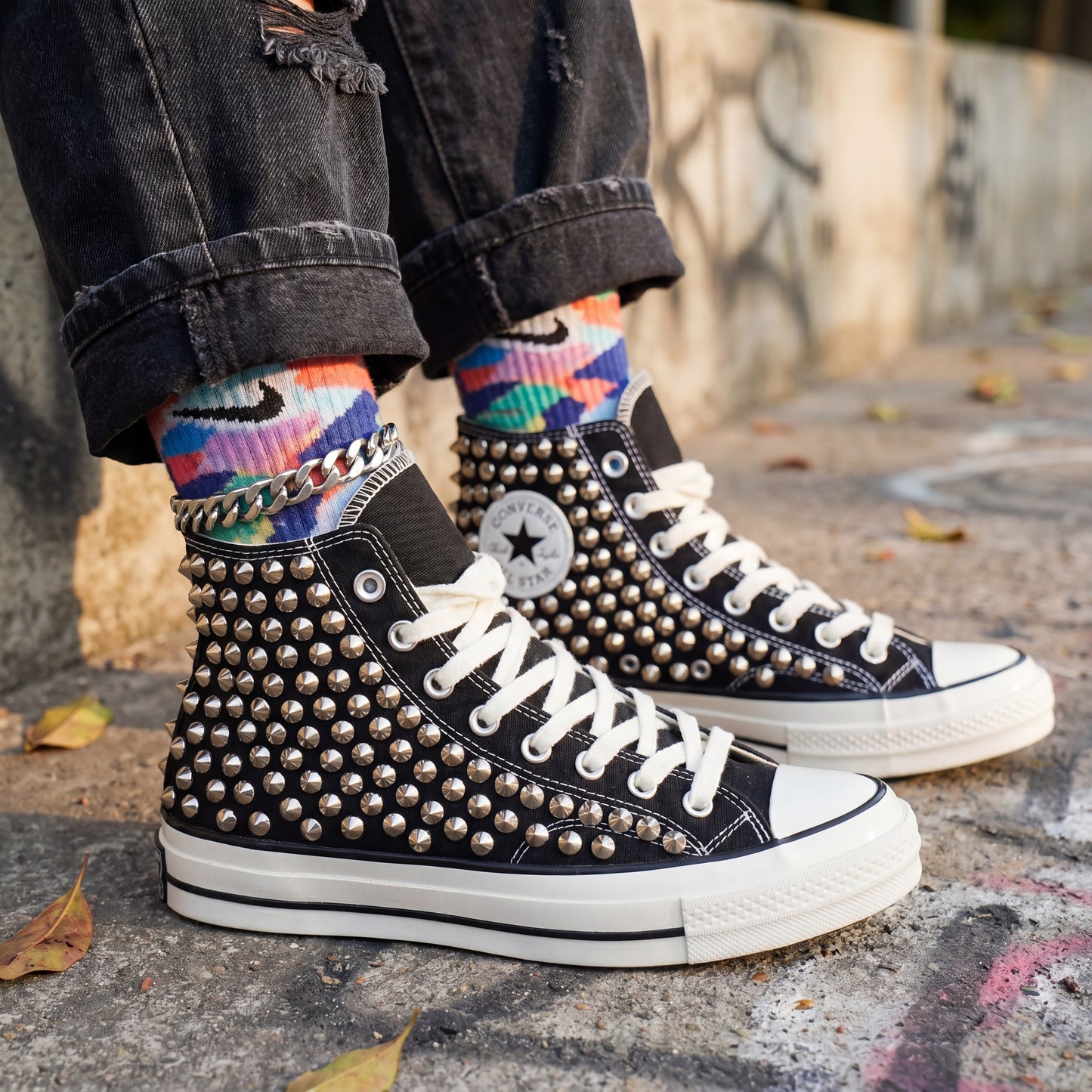 Black high top canvas sneakers with metal spikes for streetwear fashion