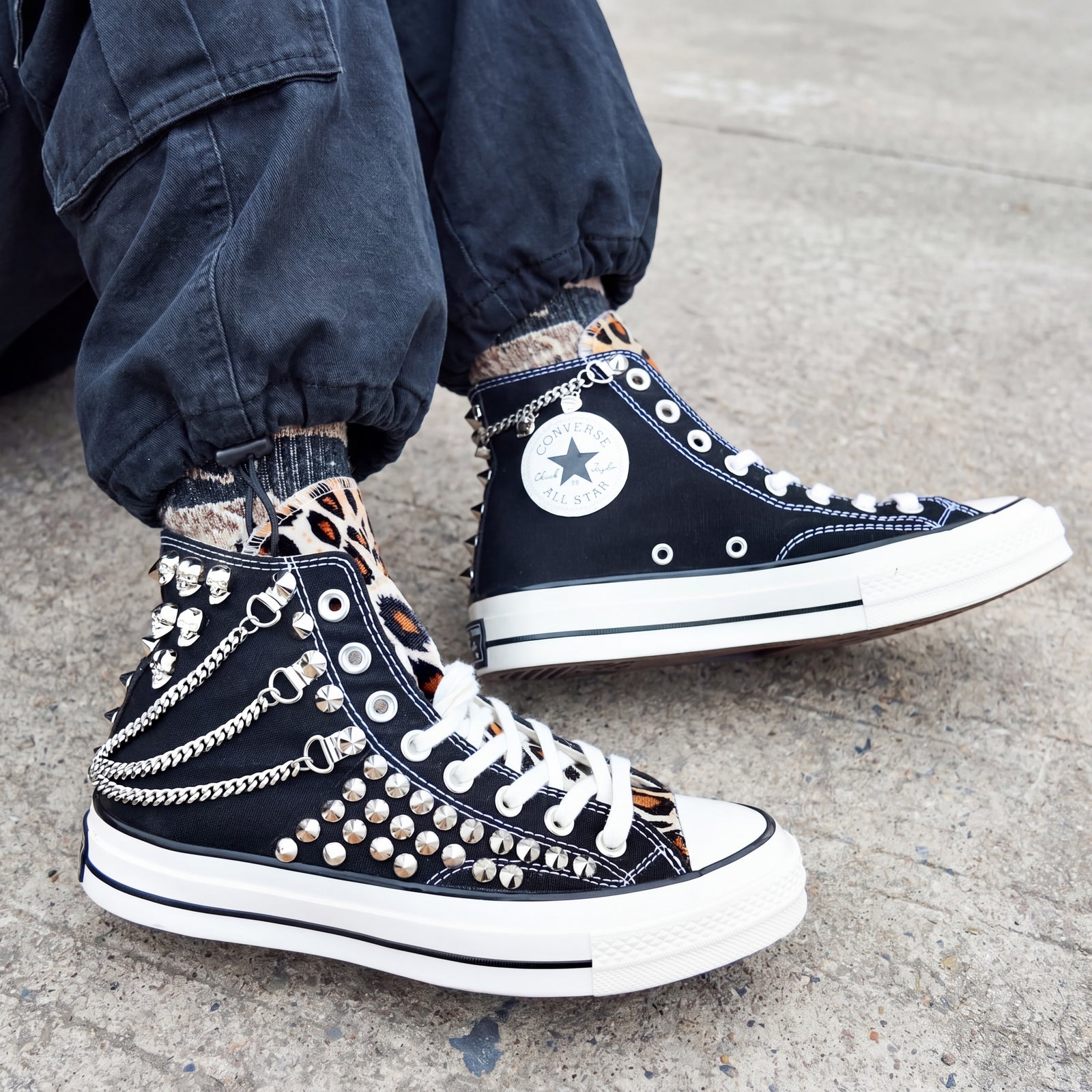 Punk streetwear canvas shoes with black upper, white laces and silver studs
