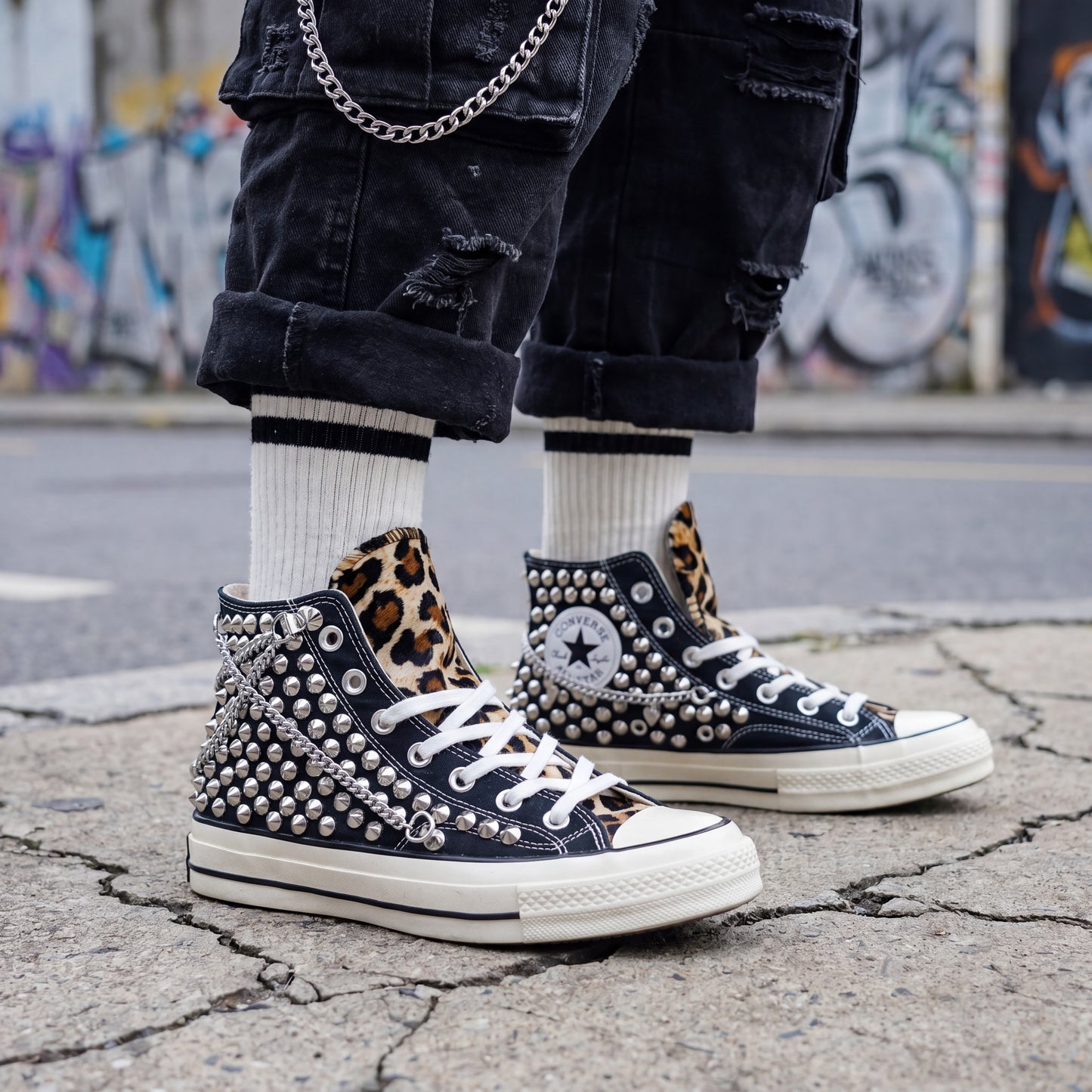 Punk rock Converse sneakers with leopard print tongue and silver spikes