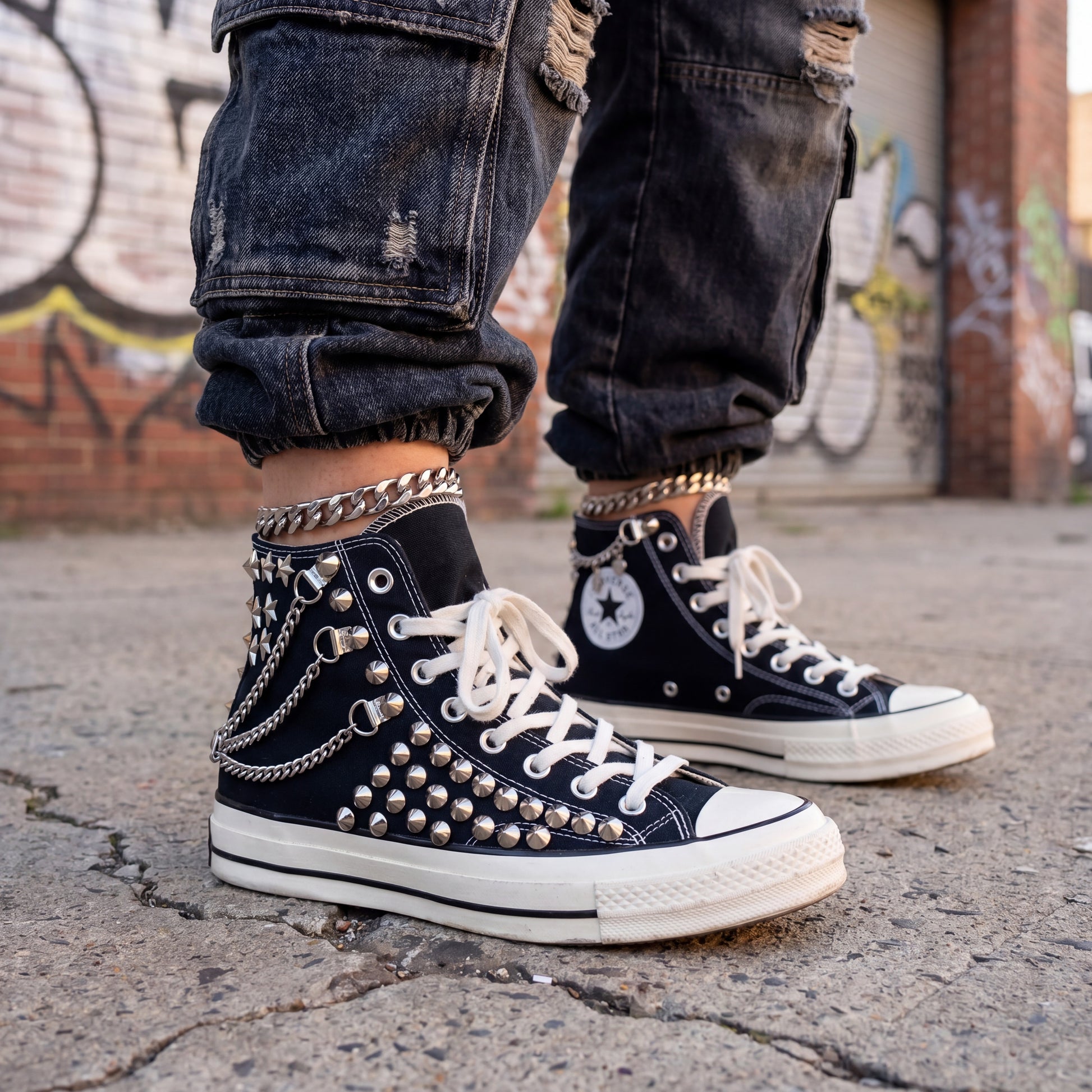 Handmade studded Converse sneakers with silver hardware and punk style
