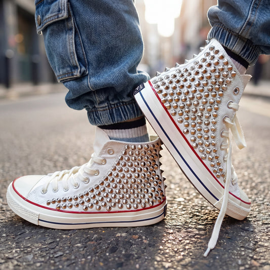 White studded high top Converse sneakers with silver spikes