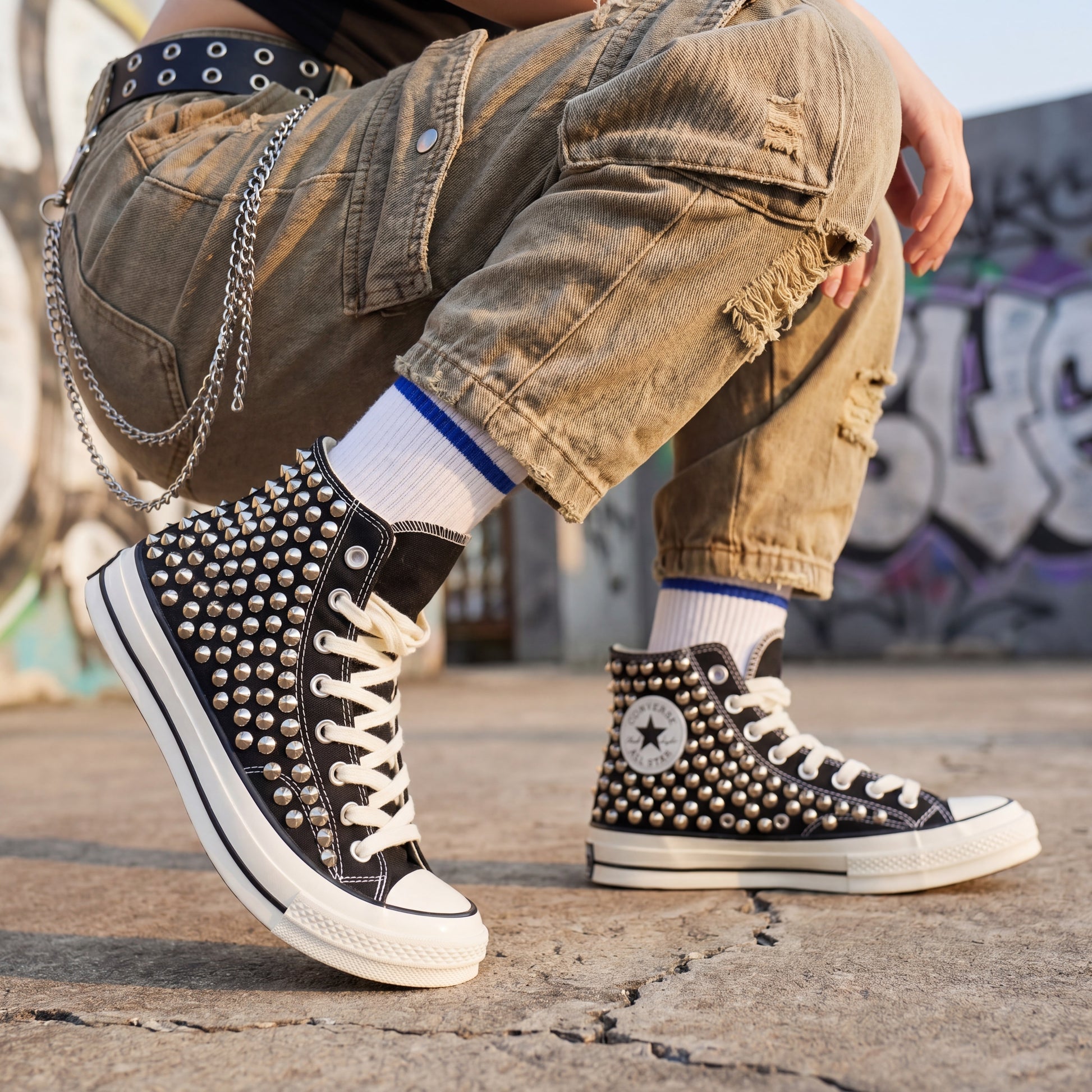 Handmade studded Converse shoes with black upper and white rubber sole