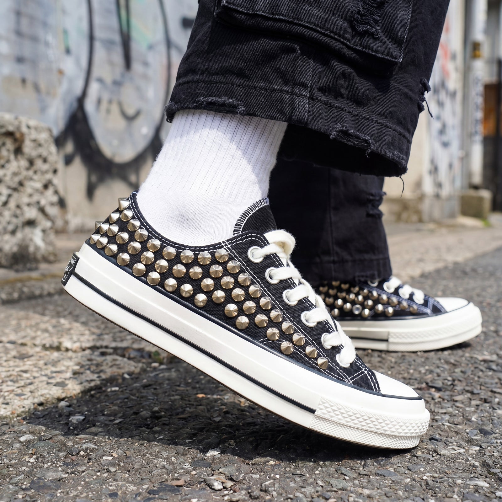 Streetwear canvas shoes with black upper and silver studded details