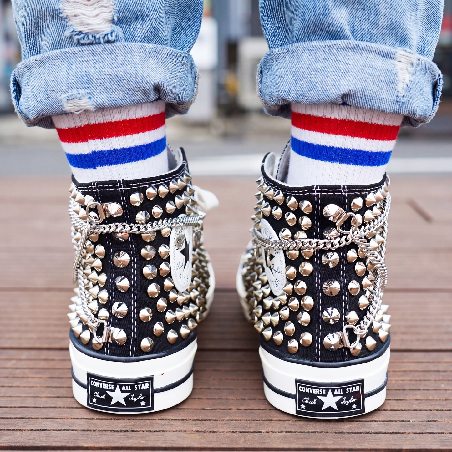 Black high top canvas sneakers with silver studded design for streetwear