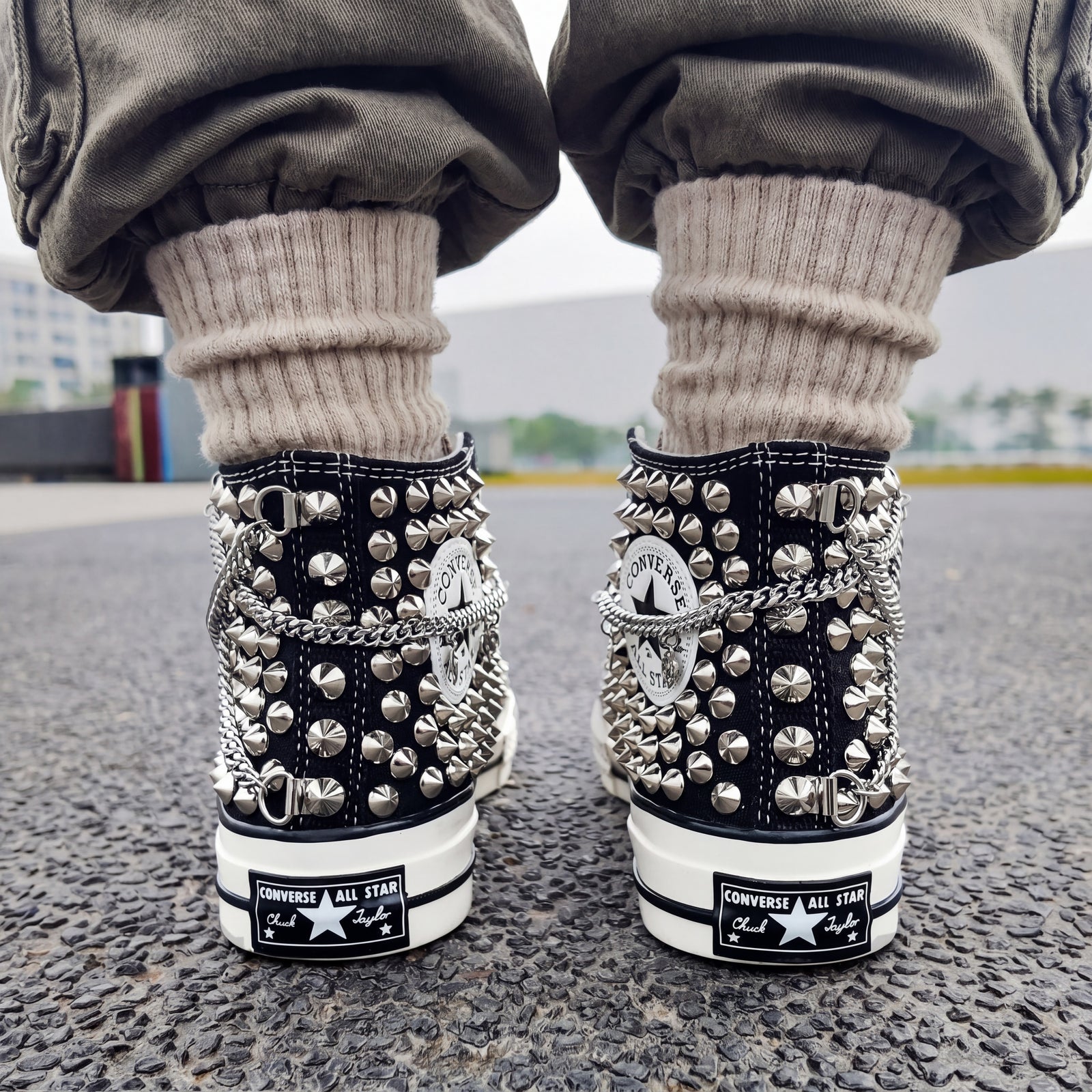 Punk streetwear canvas shoes with black upper, white laces and silver studs