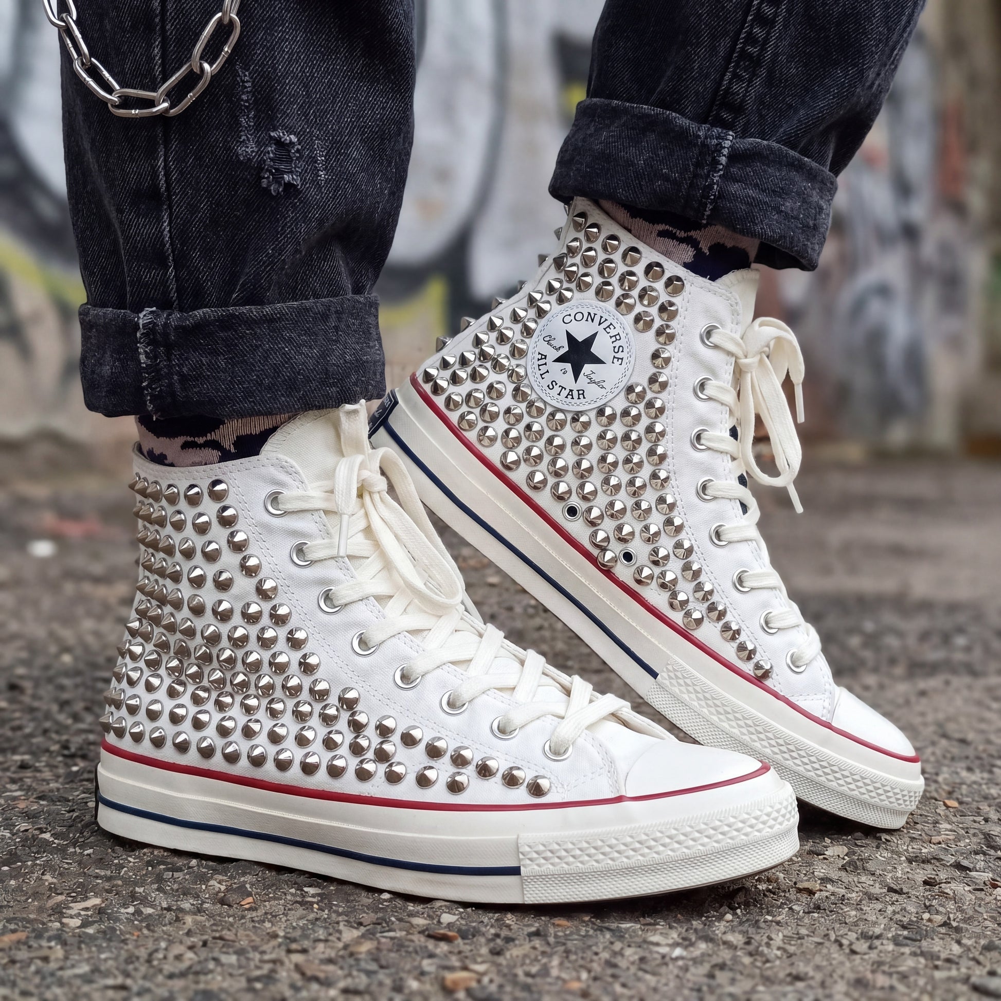Custom white Converse high top shoes with metal studs and white laces