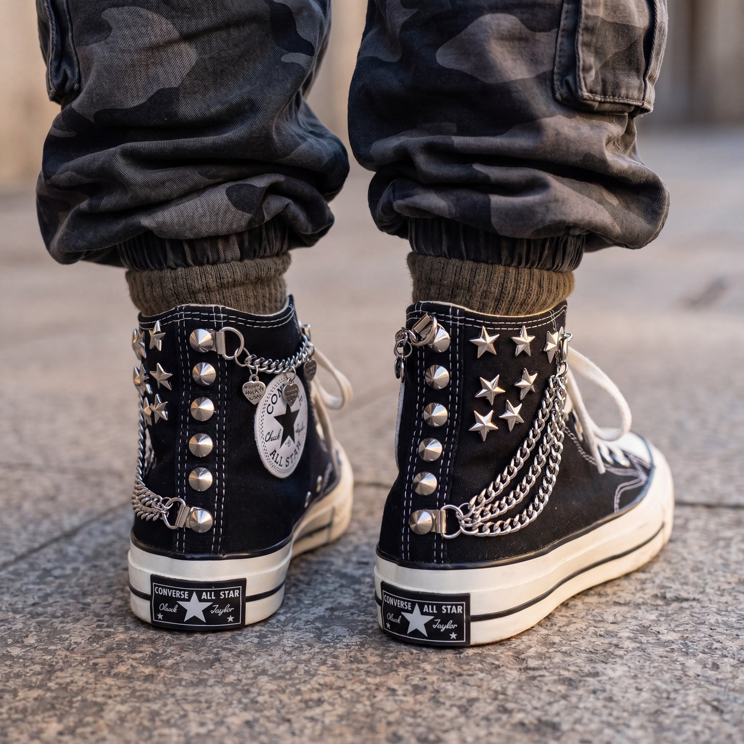 Edgy black canvas high top sneakers with chains and metal spikes