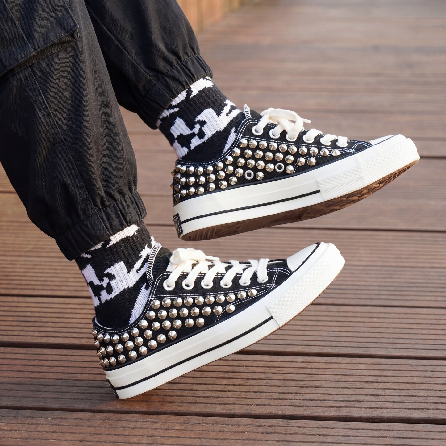 Punk rock Converse sneakers with silver studded heel design