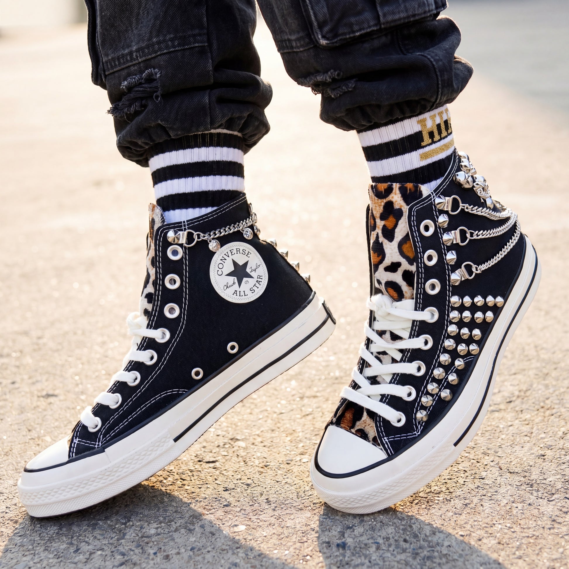 Punk rock Converse sneakers with leopard print details and silver chains