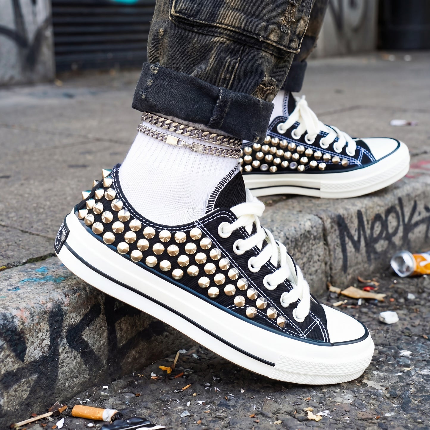 Handmade studded Converse shoes with black canvas and white rubber sole