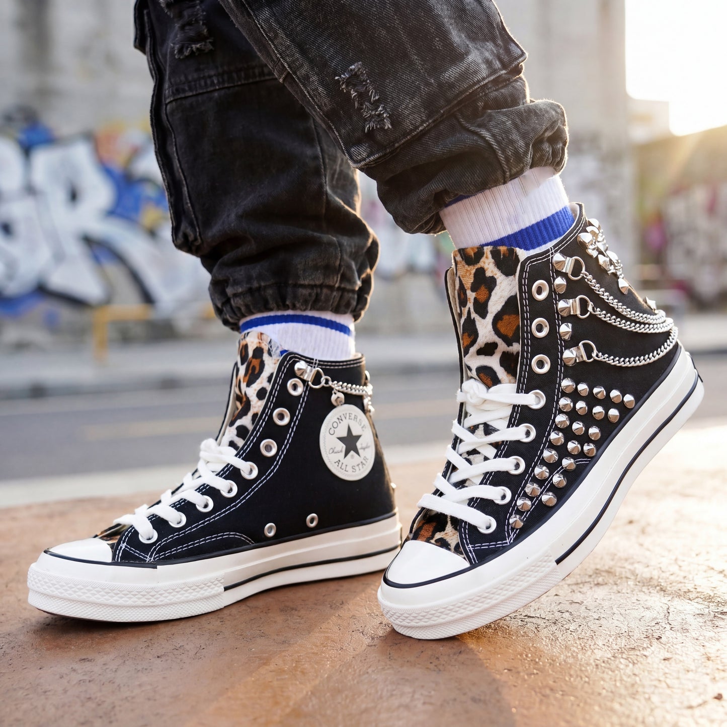 Edgy black Converse high top sneakers with silver spikes and animal print