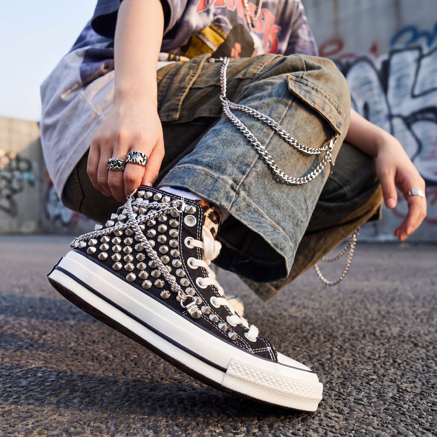 Black high top canvas sneakers with studded details for streetwear fashion