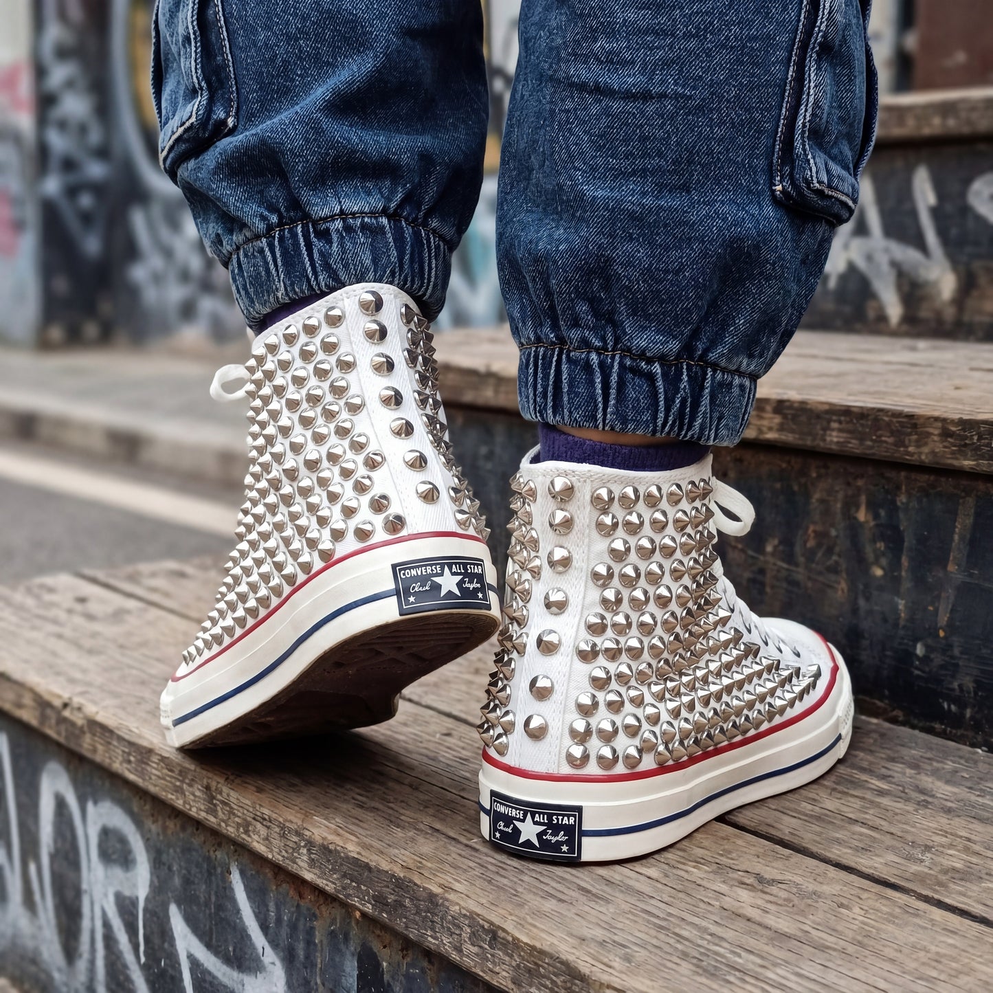 White high top canvas sneakers with silver spikes for streetwear fashion